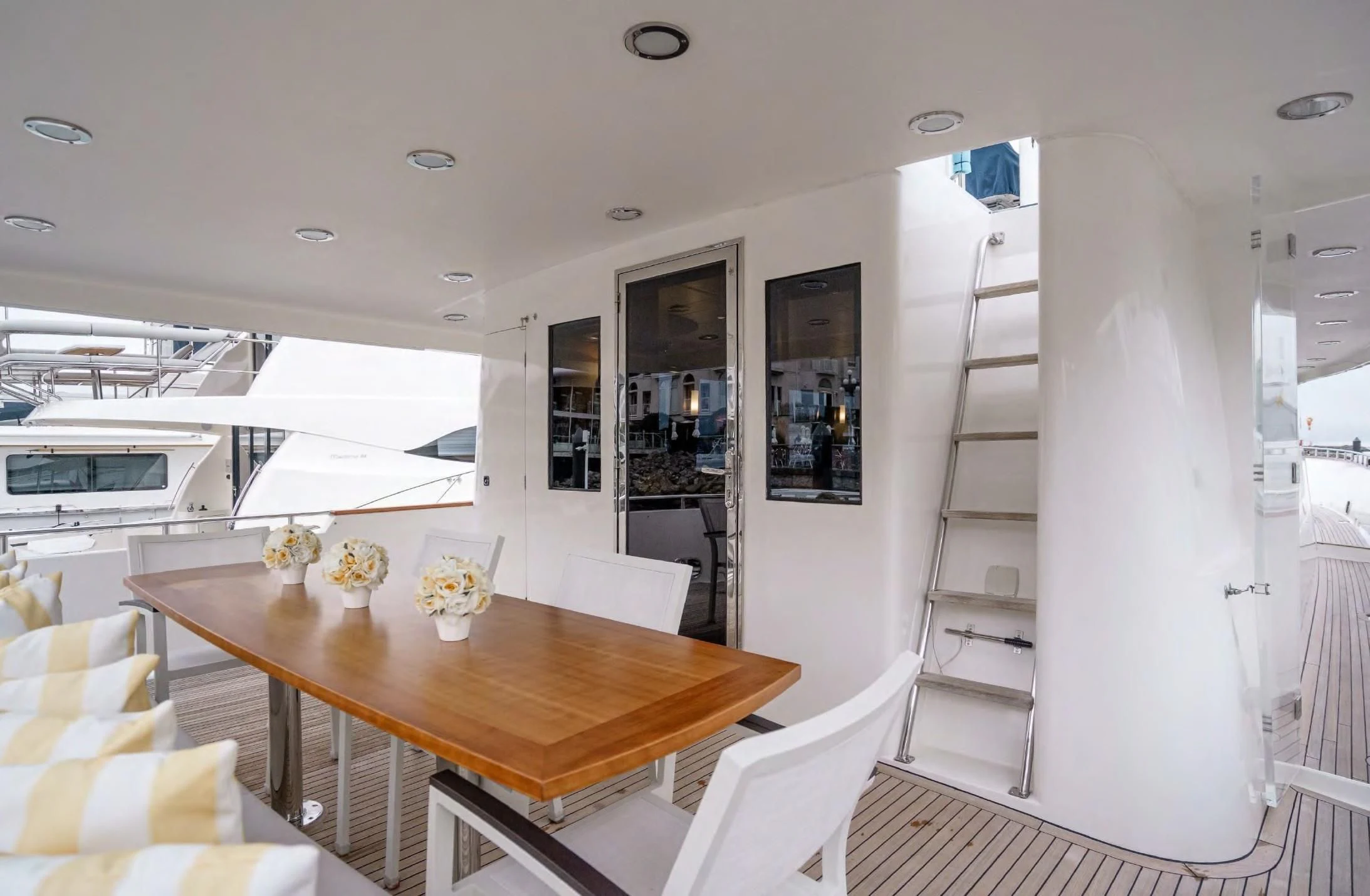 a dining table in a room aboard HAPPINESS II Yacht for Sale