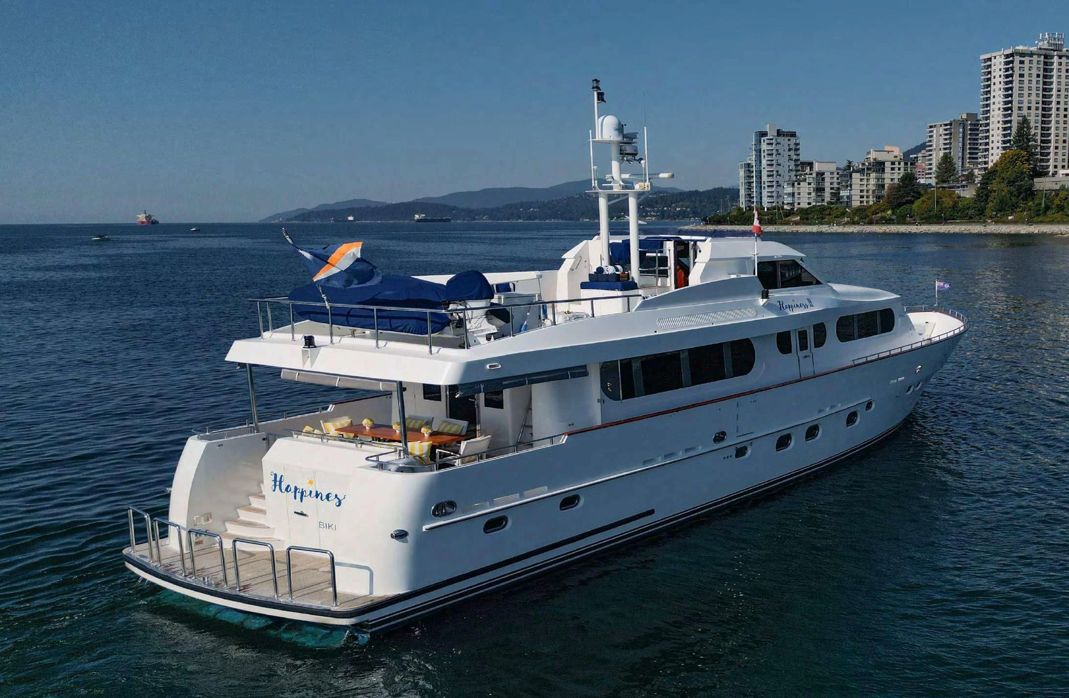 a large white boat in the water aboard HAPPINESS II Yacht for Sale