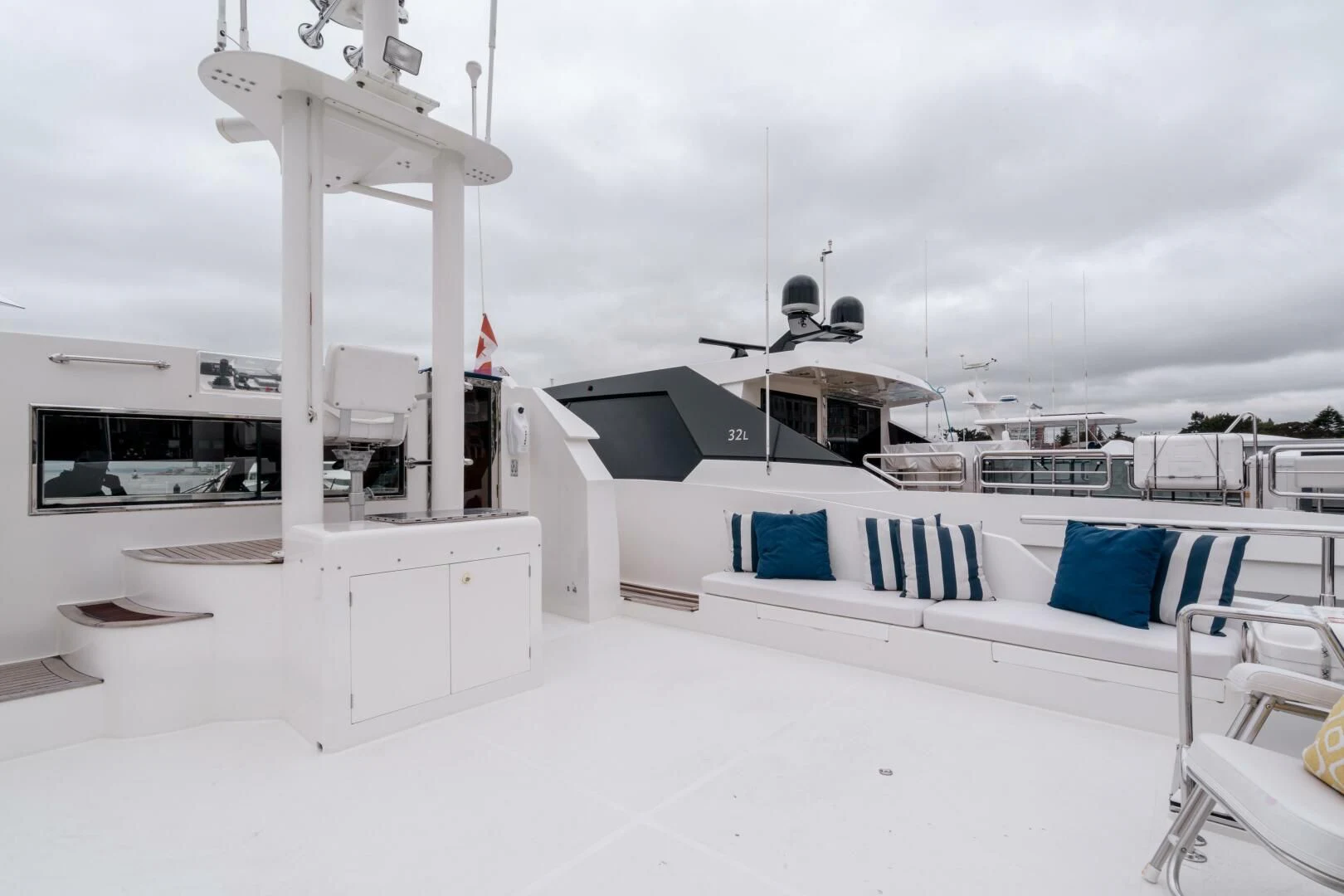 a room with a bed and a desk aboard HAPPINESS II Yacht for Sale