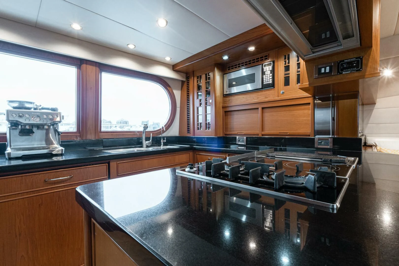 a kitchen with a large island aboard HAPPINESS II Yacht for Sale