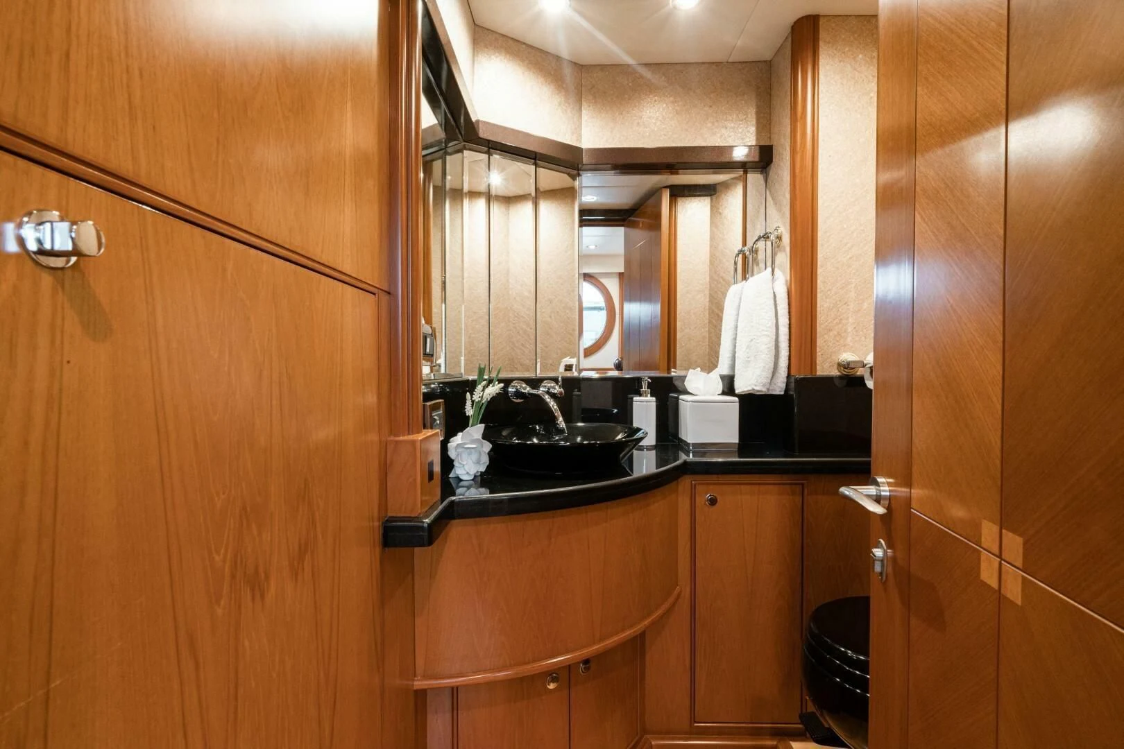 a bathroom with wooden cabinets aboard HAPPINESS II Yacht for Sale