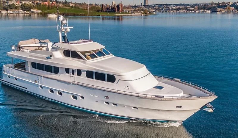 a white yacht on the water aboard HAPPINESS II Yacht for Sale