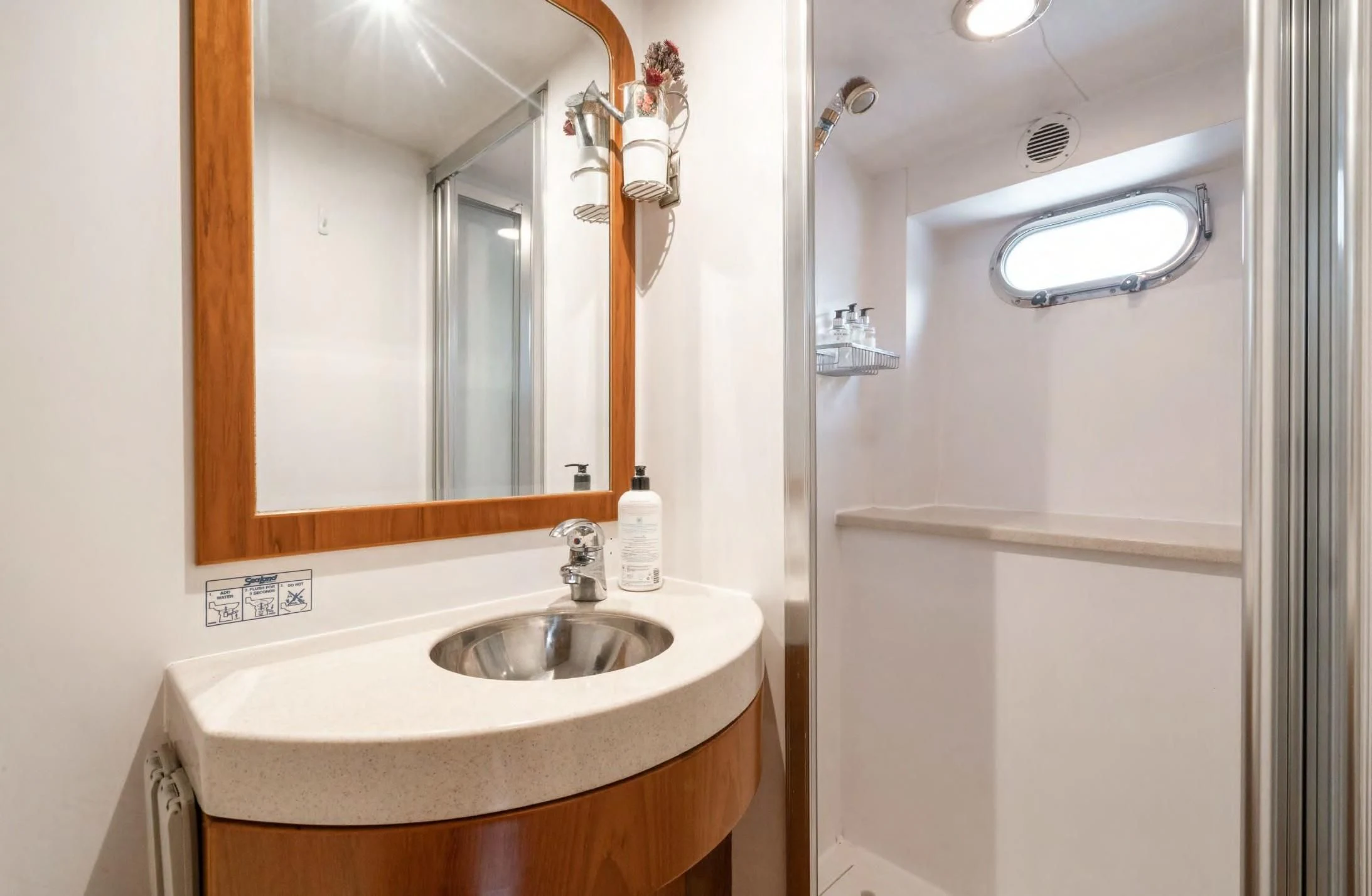 a bathroom with a sink and a mirror aboard HAPPINESS II Yacht for Sale