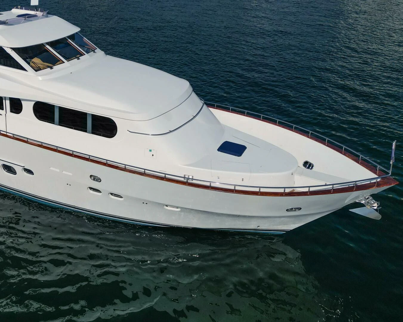 a white boat in the water aboard HAPPINESS II Yacht for Sale
