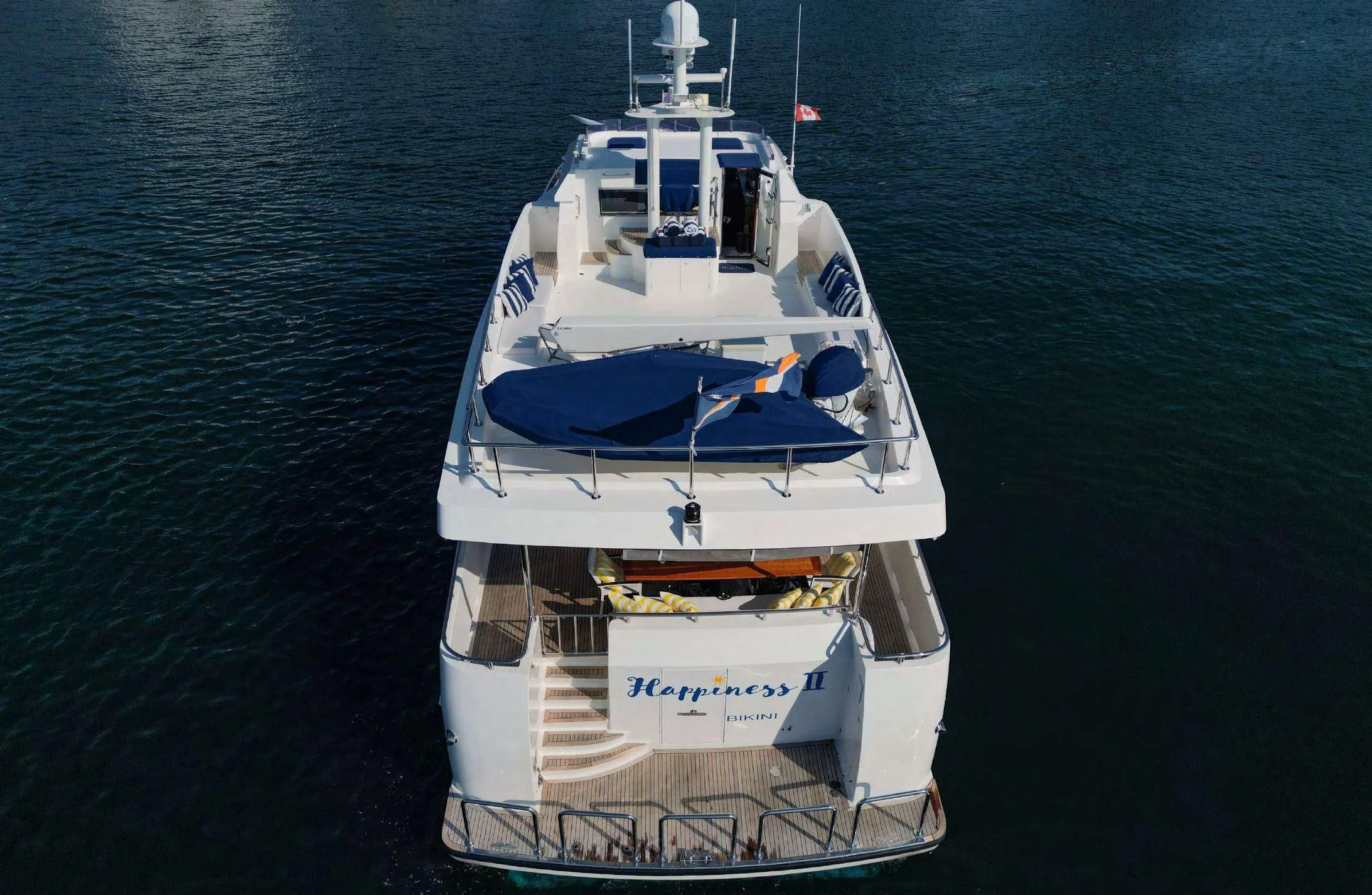 a white boat on the water aboard HAPPINESS II Yacht for Sale