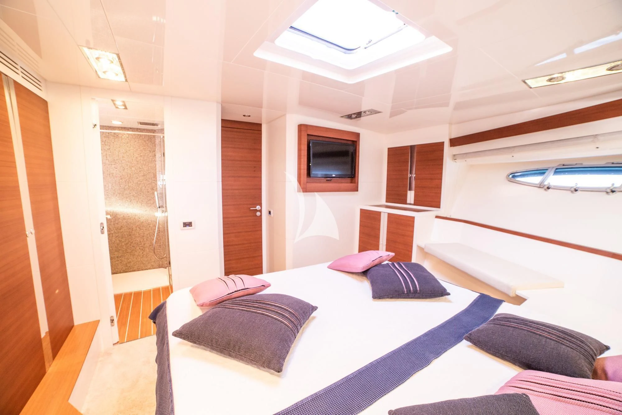 a room with a bed and a television aboard BLUE MAMBA Yacht for Sale