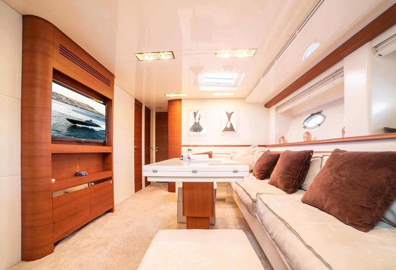 a living room with a couch and a table aboard BLUE MAMBA Yacht for Sale