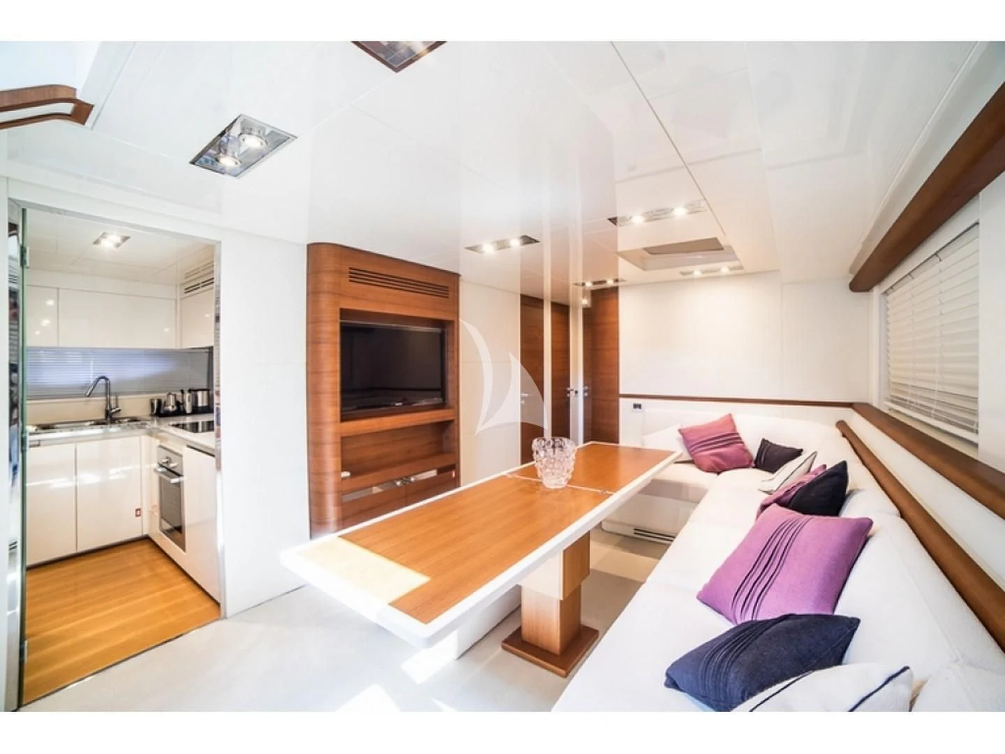 a modern looking kitchen and living room aboard BLUE MAMBA Yacht for Sale
