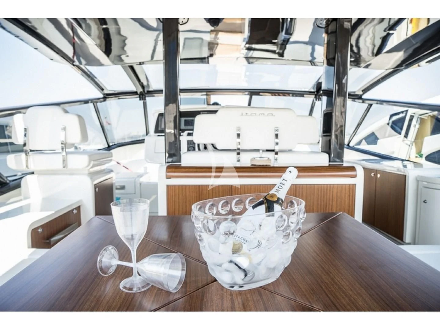 a glass of champagne on a table aboard BLUE MAMBA Yacht for Sale