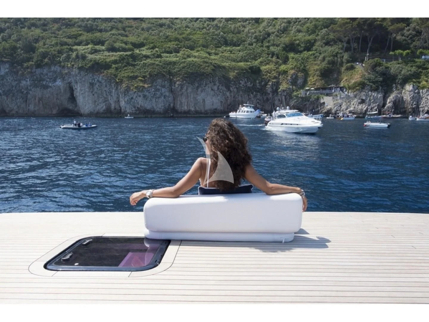 a person sitting on a boat aboard BLUE MAMBA Yacht for Sale