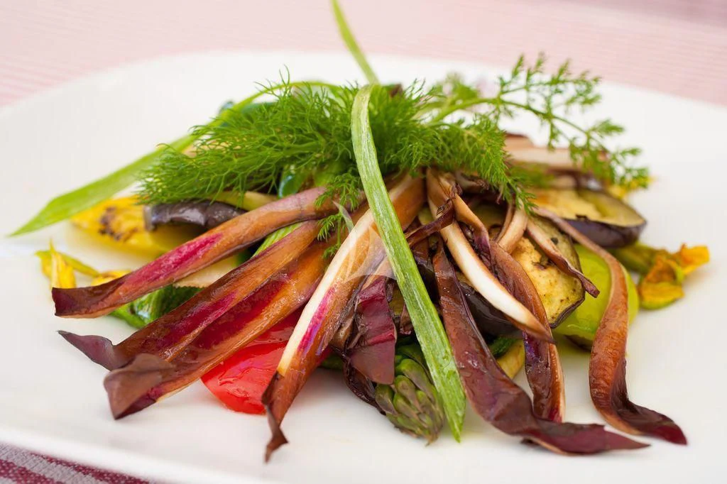 a pile of cooked vegetables aboard BLUE MAMBA Yacht for Sale