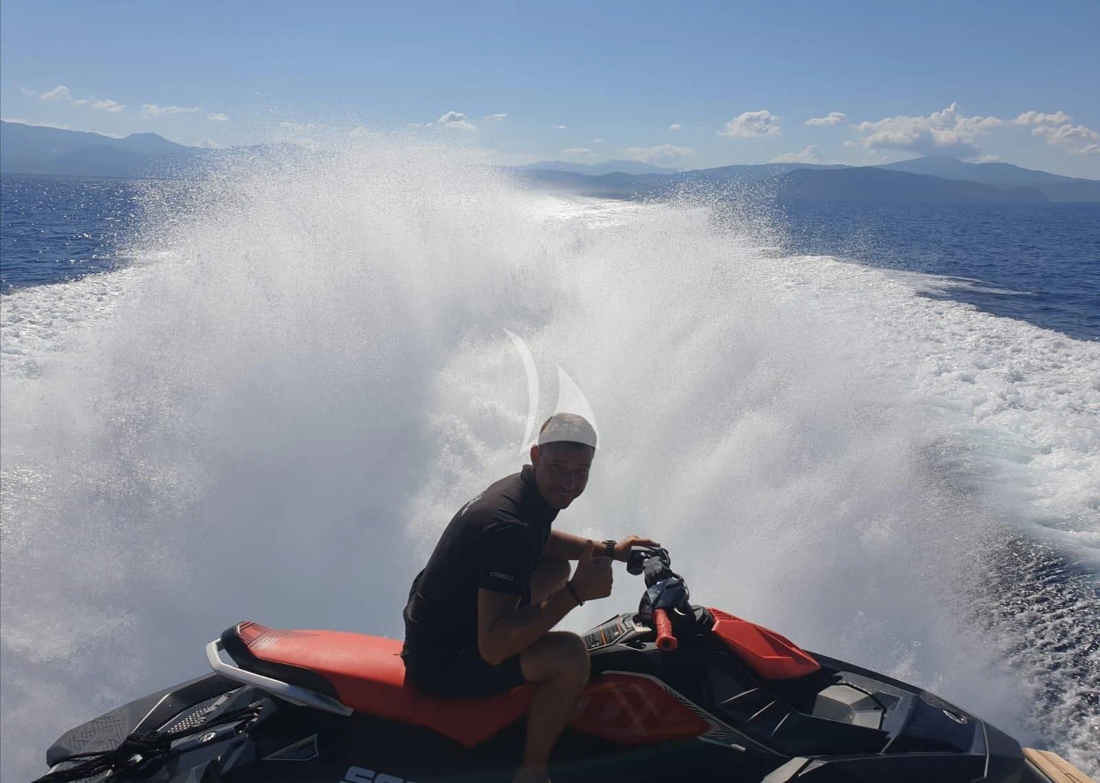 a man on a jet ski aboard BLUE MAMBA Yacht for Sale