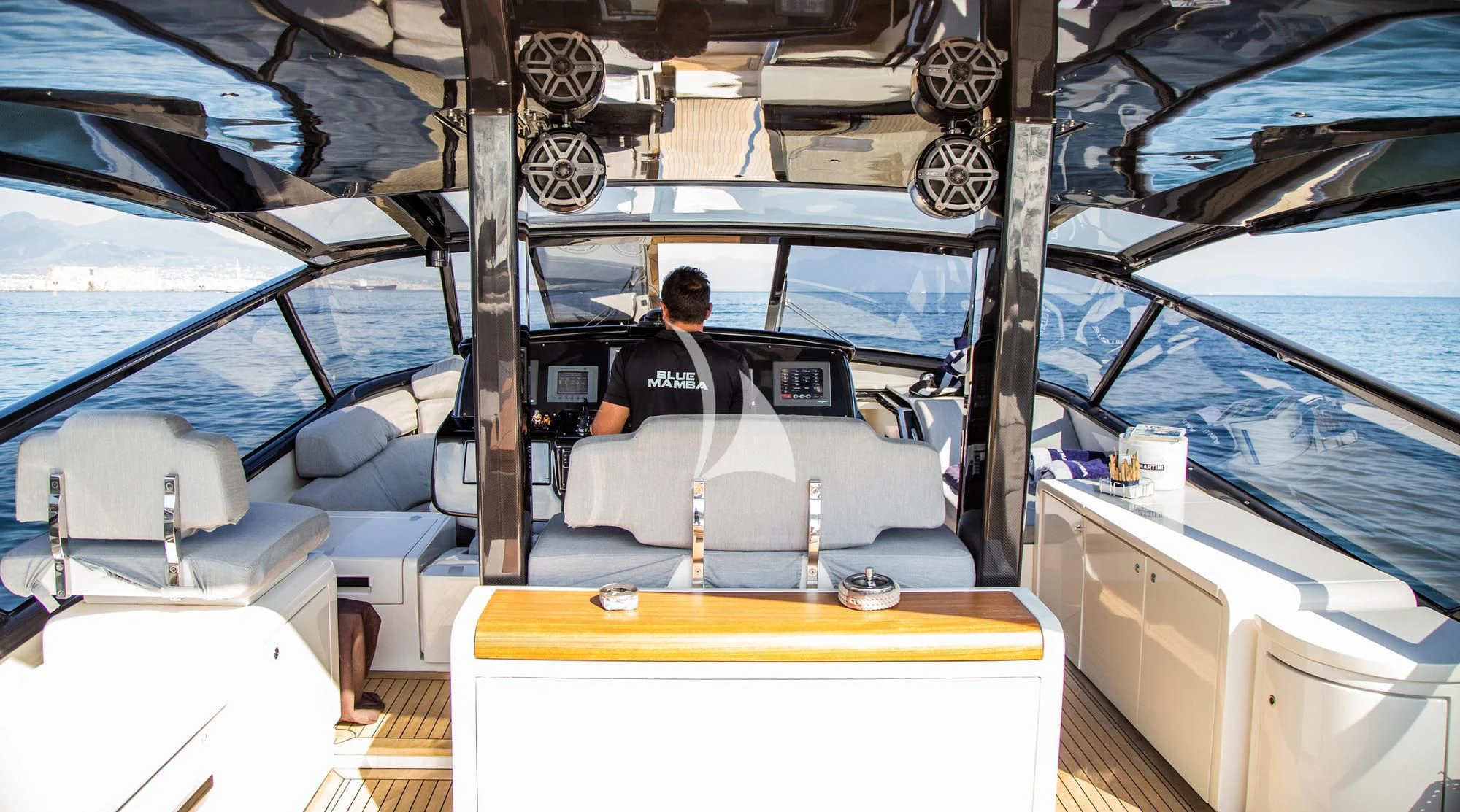 a person sitting in a car aboard BLUE MAMBA Yacht for Sale