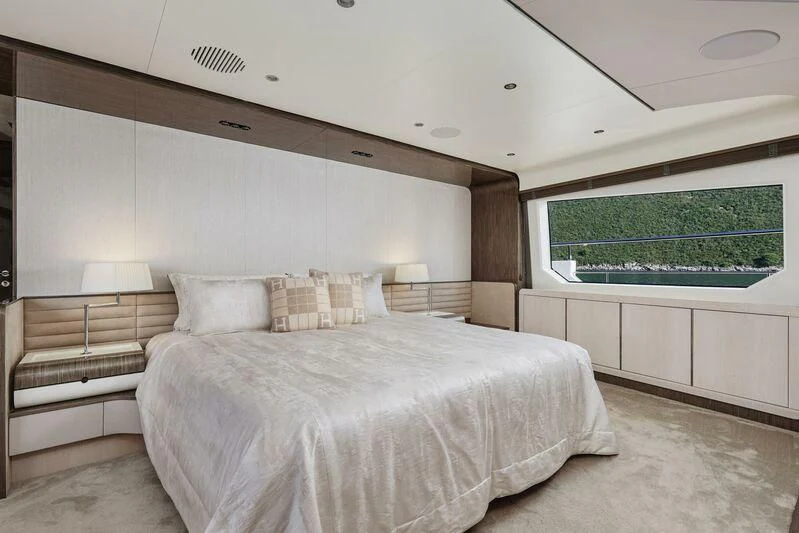 a room with a bed and a window aboard SILVIA Yacht for Sale