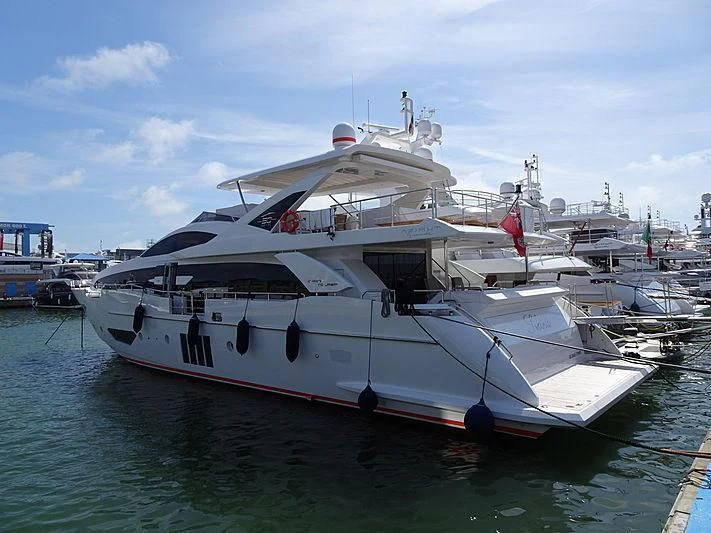 a large white boat in a harbor aboard SILVIA Yacht for Sale