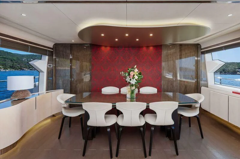 a dining room with a table and chairs aboard SILVIA Yacht for Sale