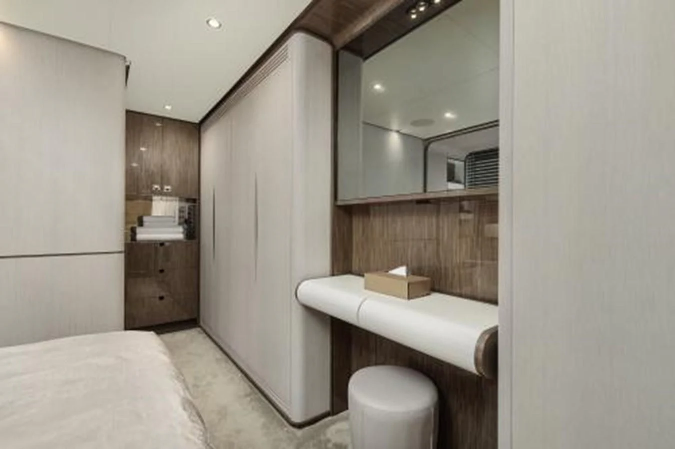 a bedroom with a bed and a mirror aboard SILVIA Yacht for Sale