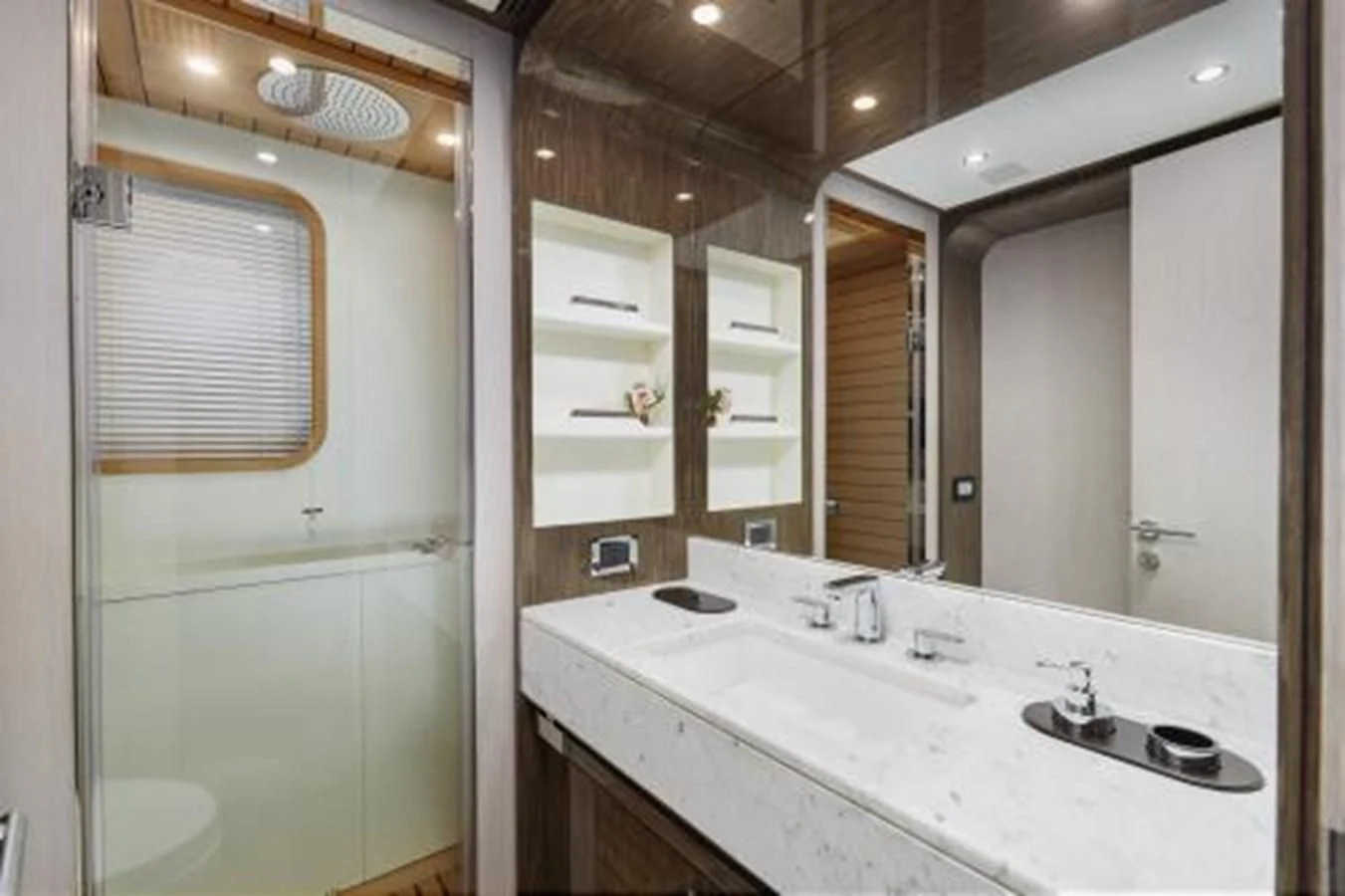 a bathroom with a large mirror aboard SILVIA Yacht for Sale