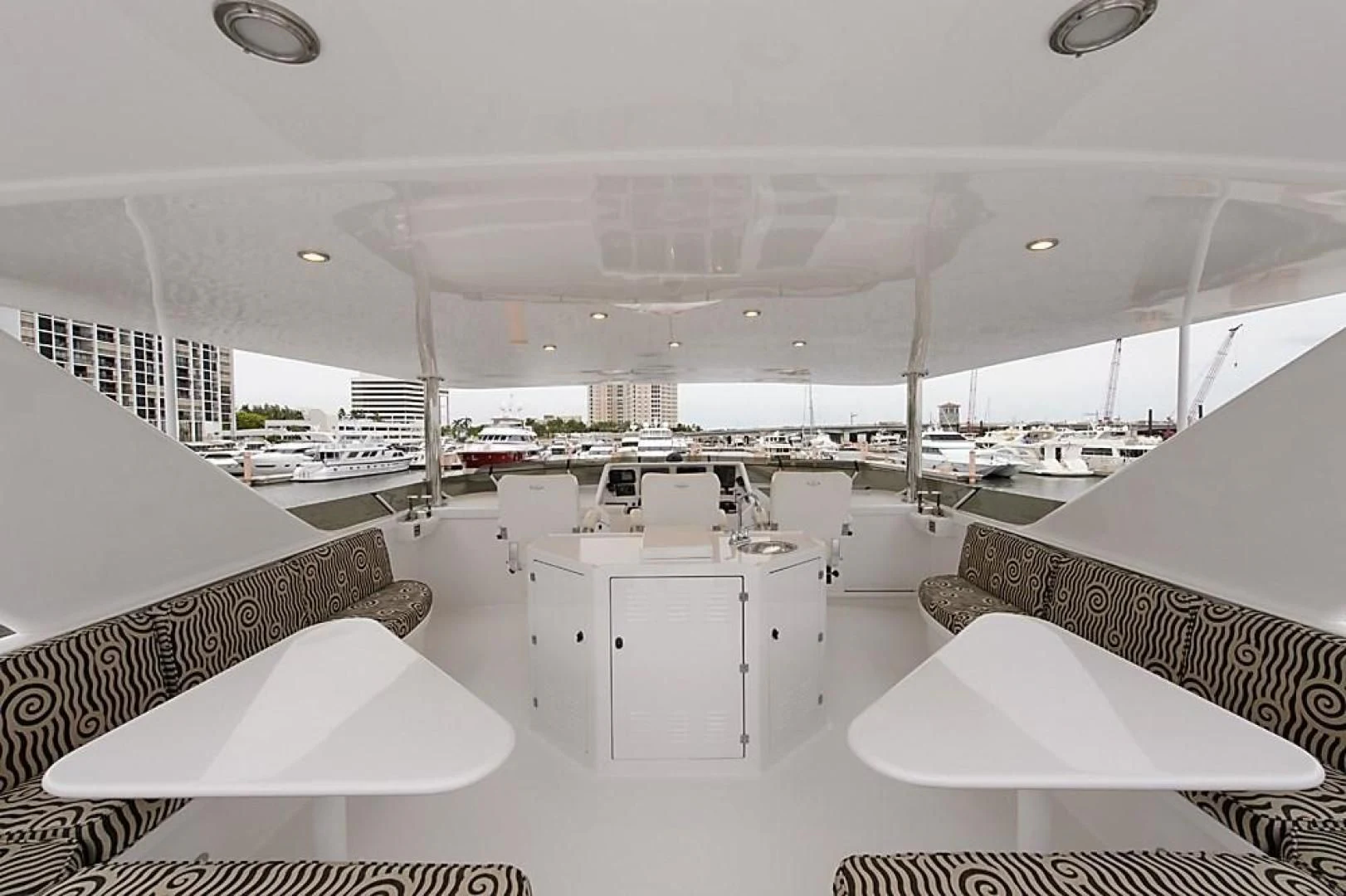 a large room with white tables and chairs aboard MALDAU Yacht for Sale