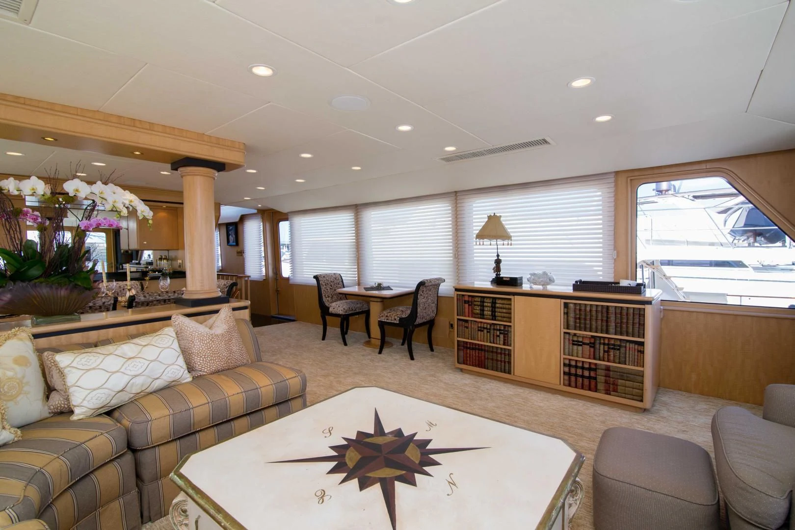 a living room with a couch and a coffee table aboard MALDAU Yacht for Sale
