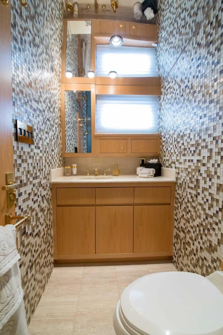 a bathroom with a toilet and a sink aboard MALDAU Yacht for Sale