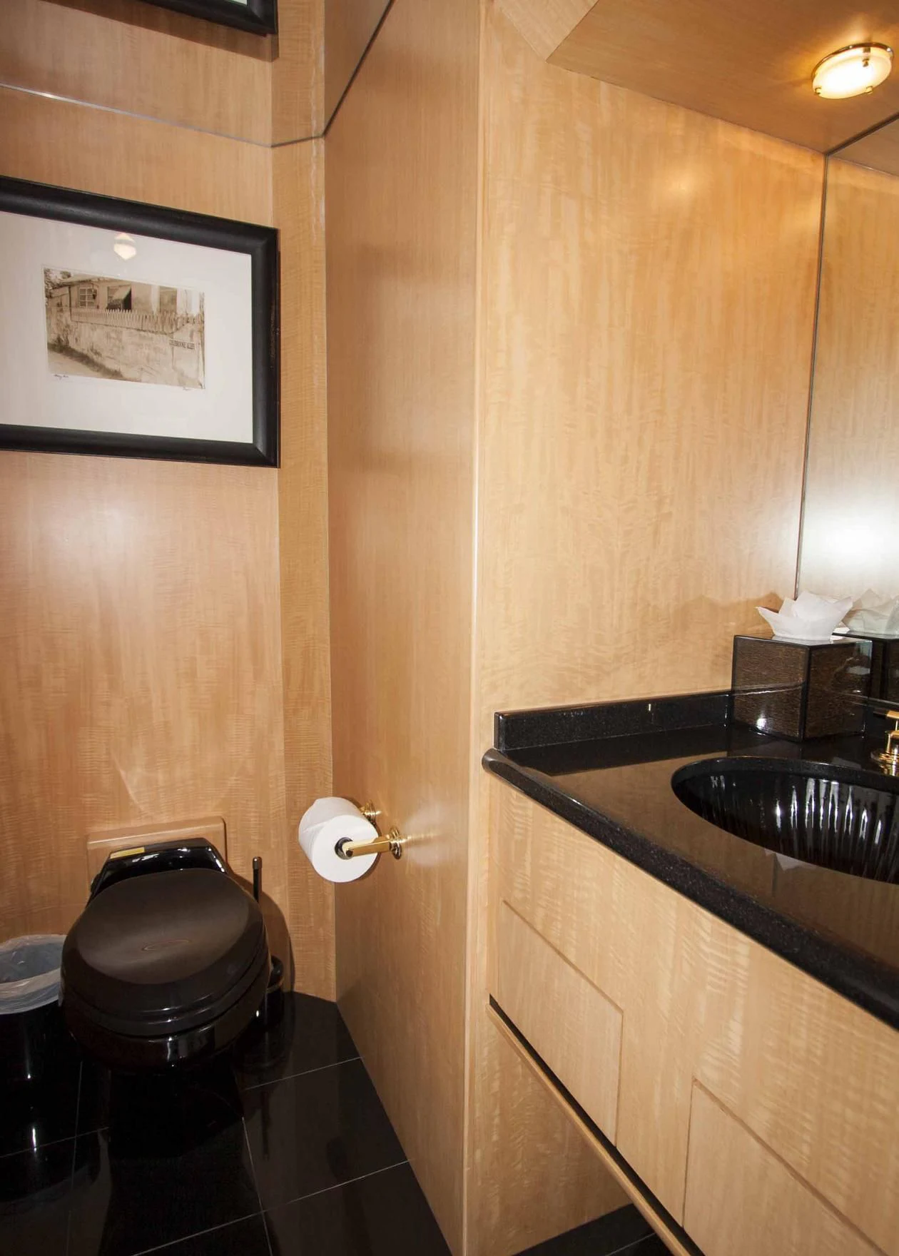 a bathroom with a wood wall aboard MALDAU Yacht for Sale