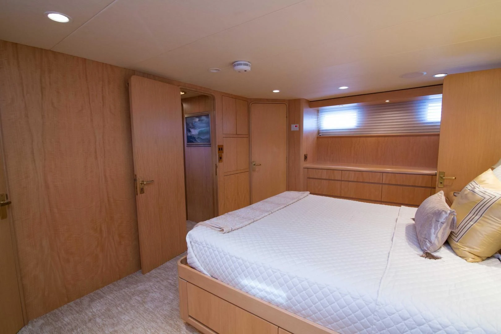 a bedroom with a bed and a closet aboard MALDAU Yacht for Sale