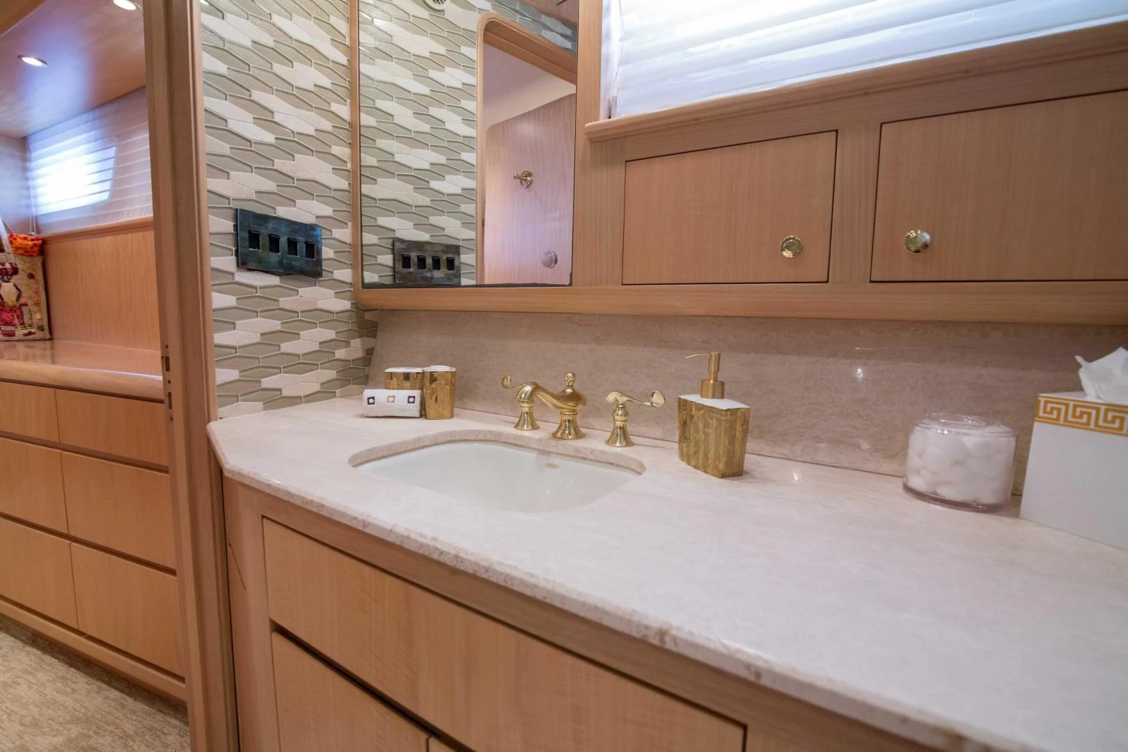 a bathroom with a countertop sink and cabinets aboard MALDAU Yacht for Sale