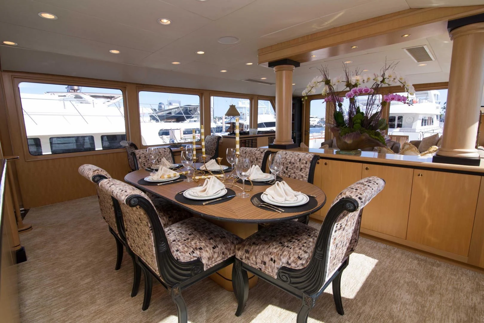 a dining room with a table and chairs aboard MALDAU Yacht for Sale