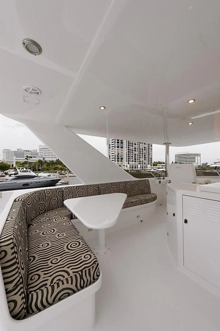 a room with a table and chairs aboard MALDAU Yacht for Sale