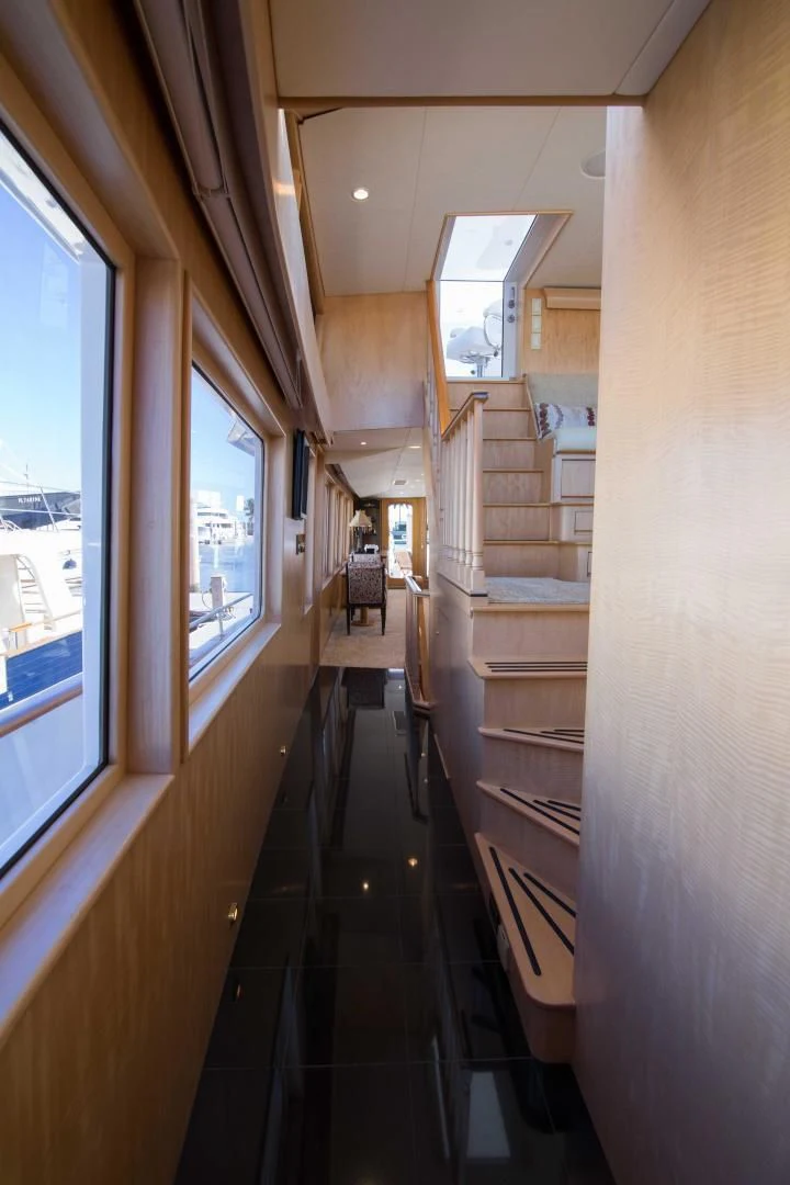 a hallway with wooden stairs aboard MALDAU Yacht for Sale