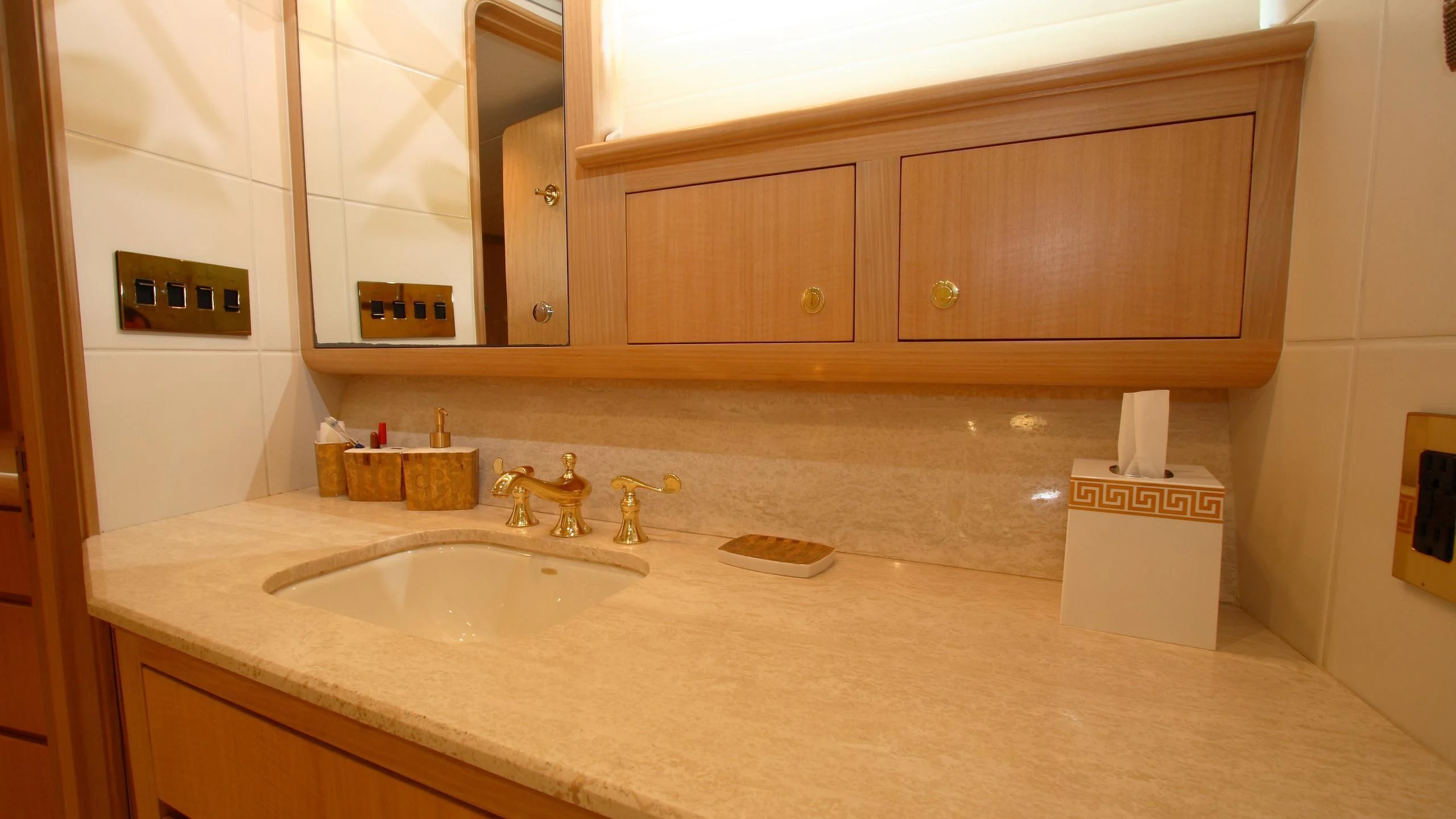 a bathroom with a countertop sink and cabinets aboard MALDAU Yacht for Sale
