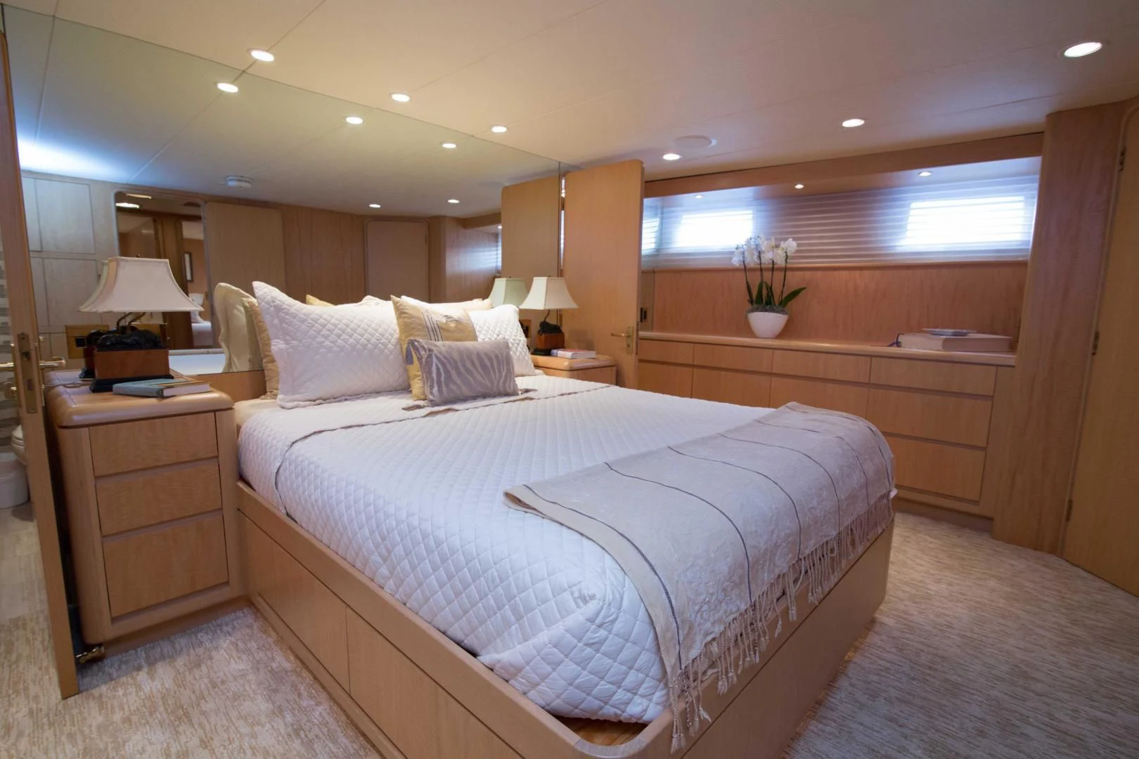 a bedroom with a bed and a desk aboard MALDAU Yacht for Sale