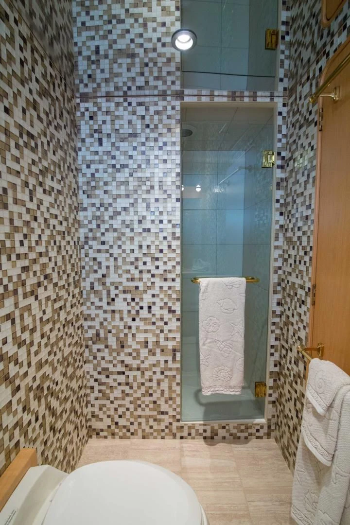 a bathroom with a glass shower aboard MALDAU Yacht for Sale