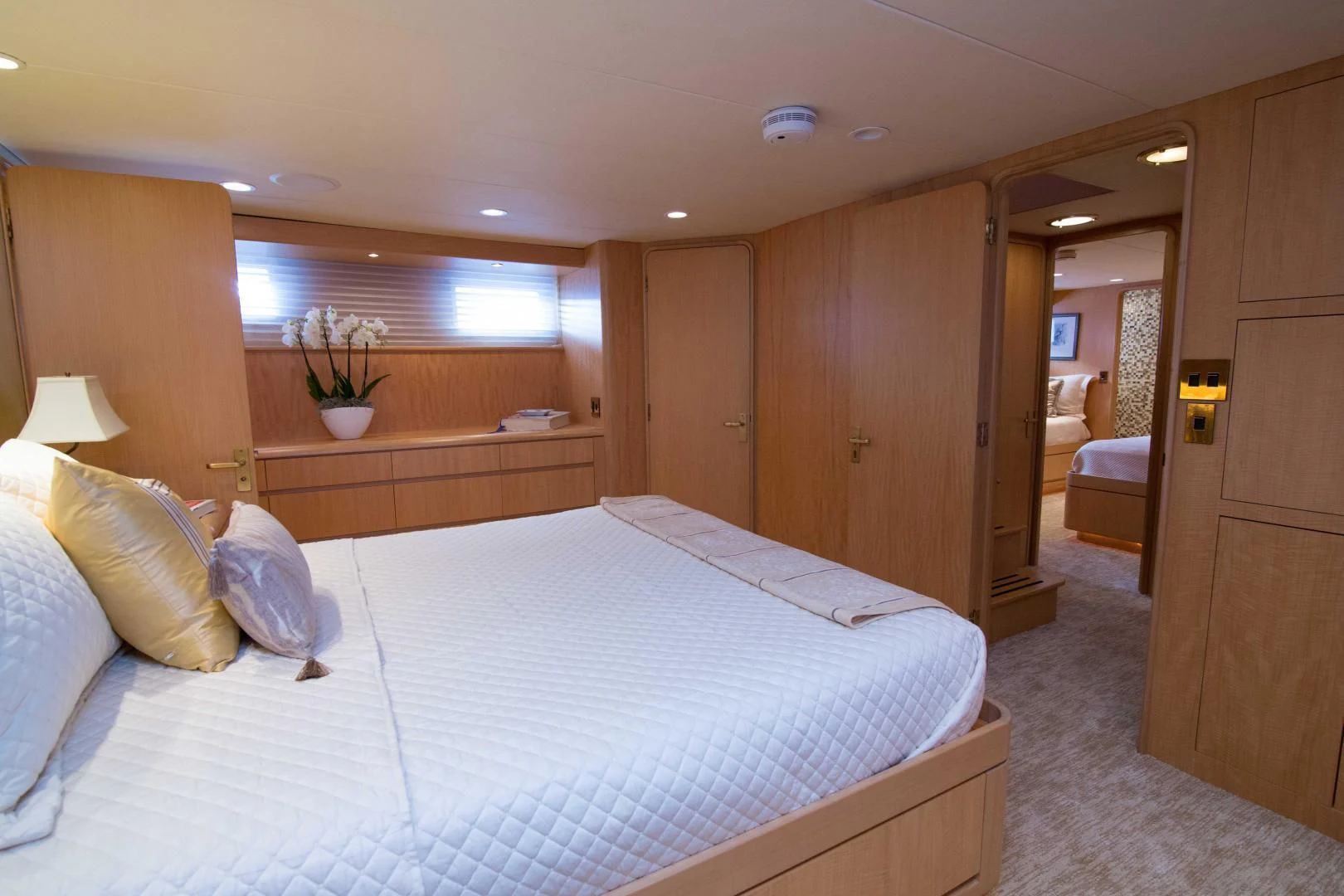 a bedroom with a bed and a desk aboard MALDAU Yacht for Sale