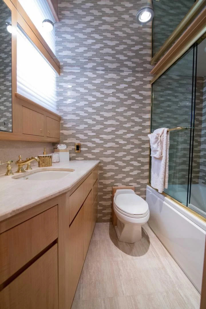 a bathroom with a toilet sink and a bathtub aboard MALDAU Yacht for Sale