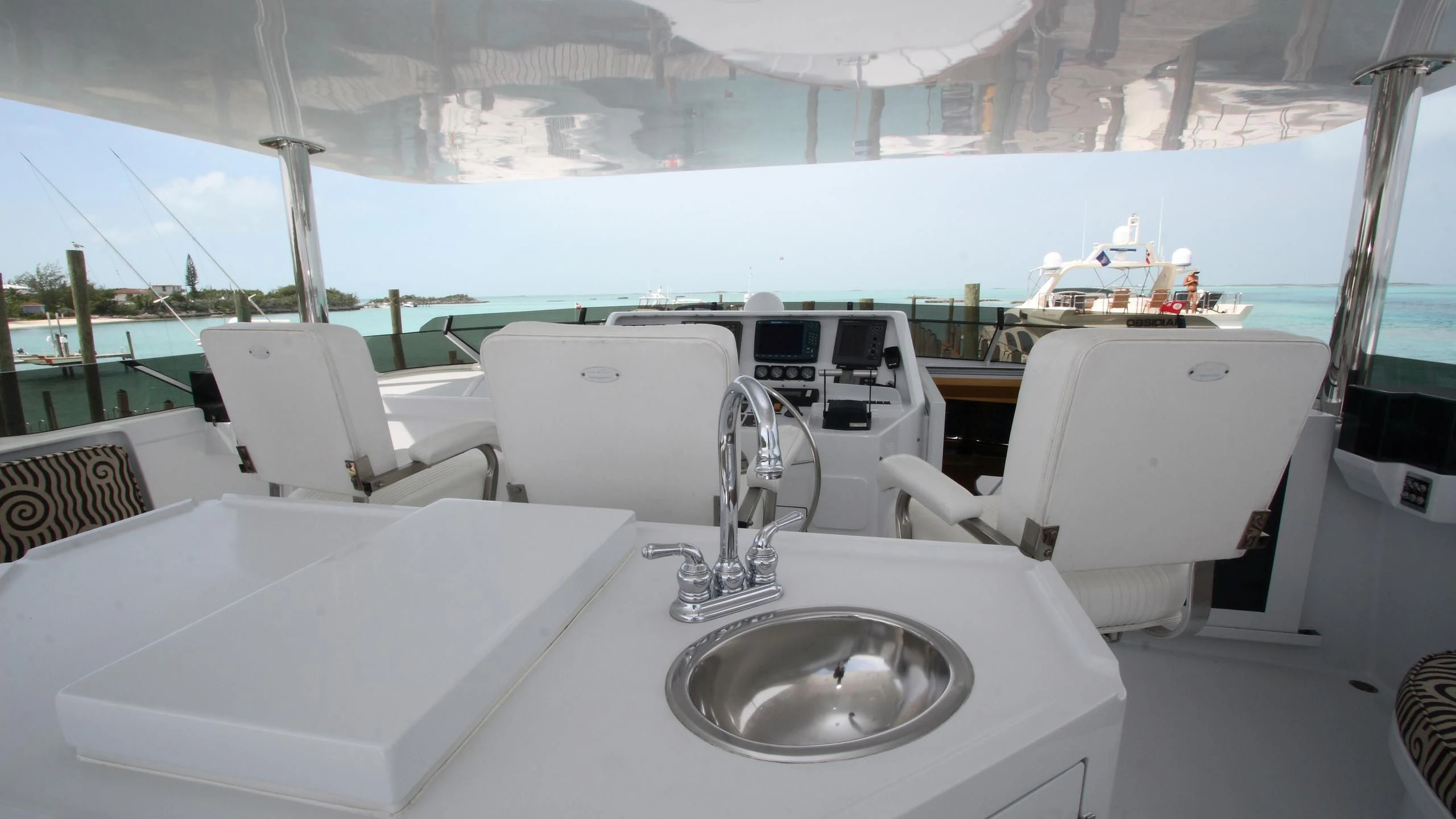 a white boat with a sink and chairs on a boat aboard MALDAU Yacht for Sale