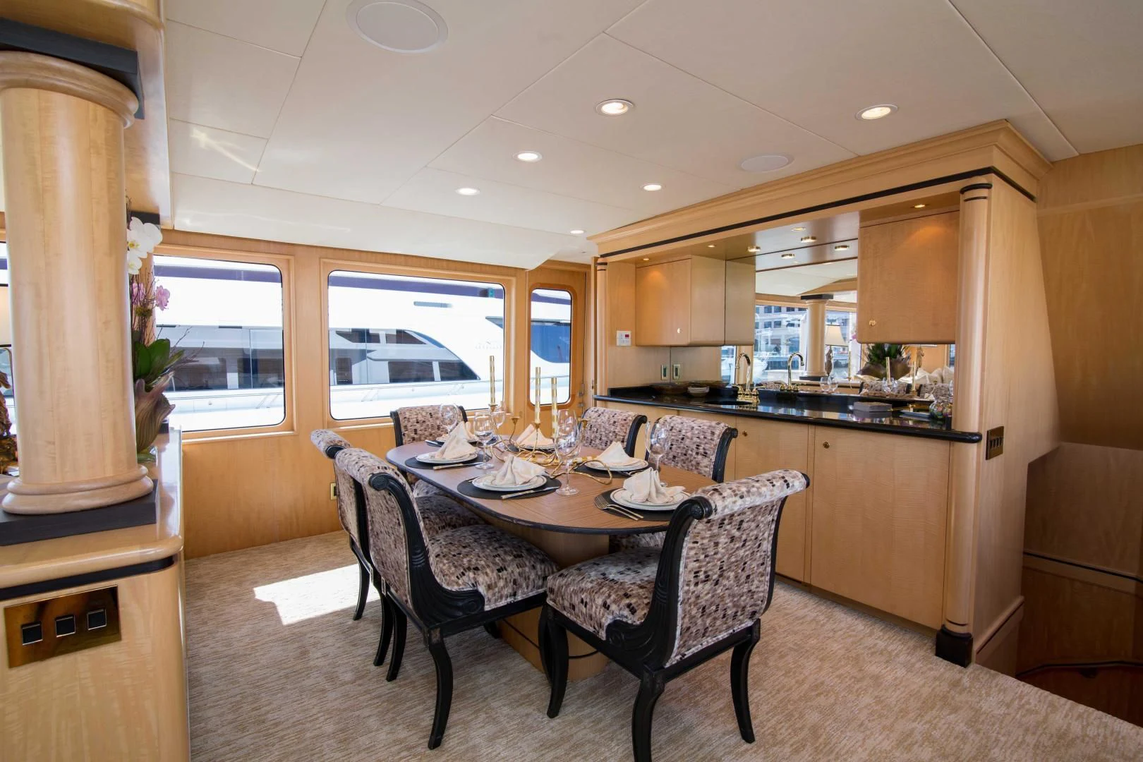 a kitchen with a dining table aboard MALDAU Yacht for Sale