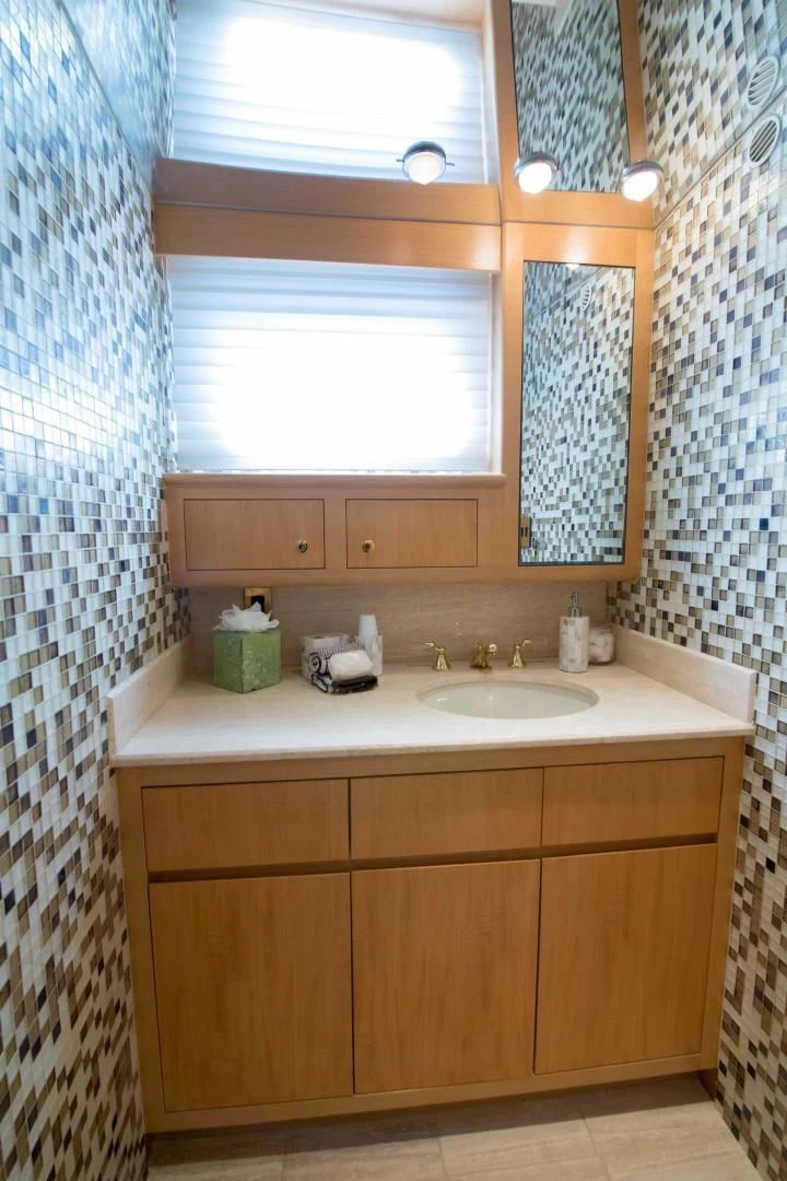 a bathroom with a sink and a window aboard MALDAU Yacht for Sale