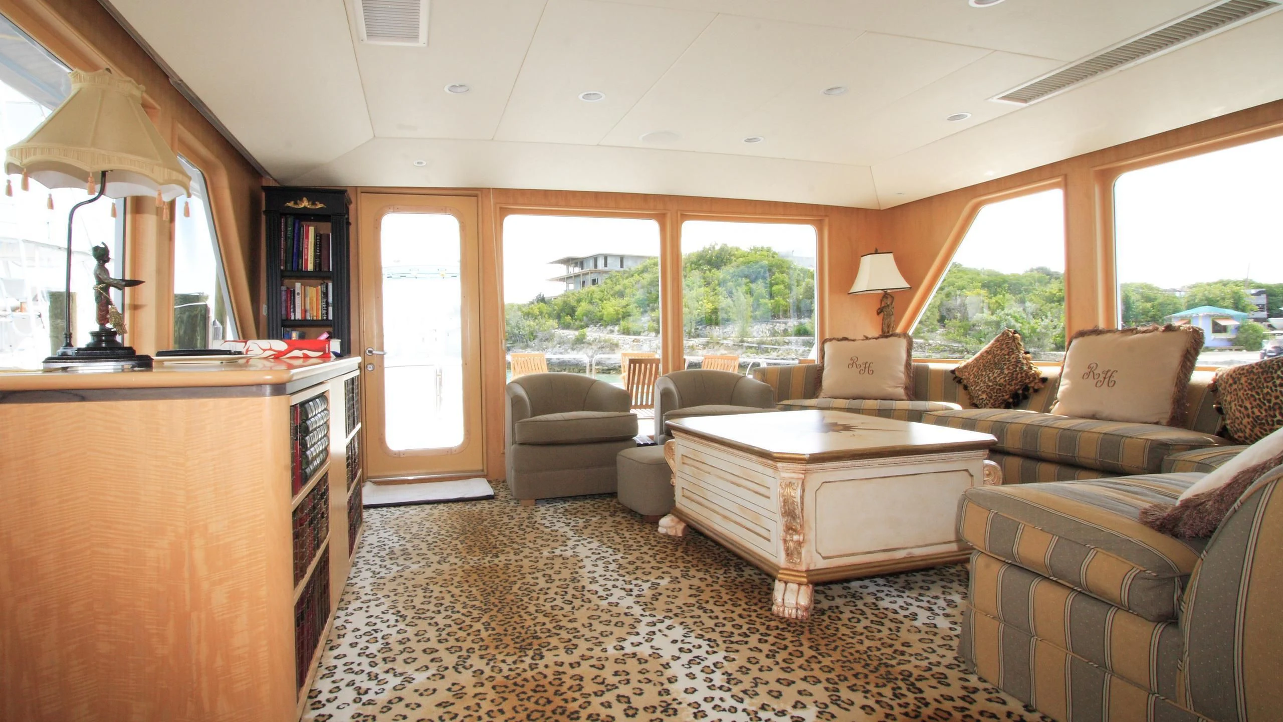 a living room with a couch and a coffee table aboard MALDAU Yacht for Sale