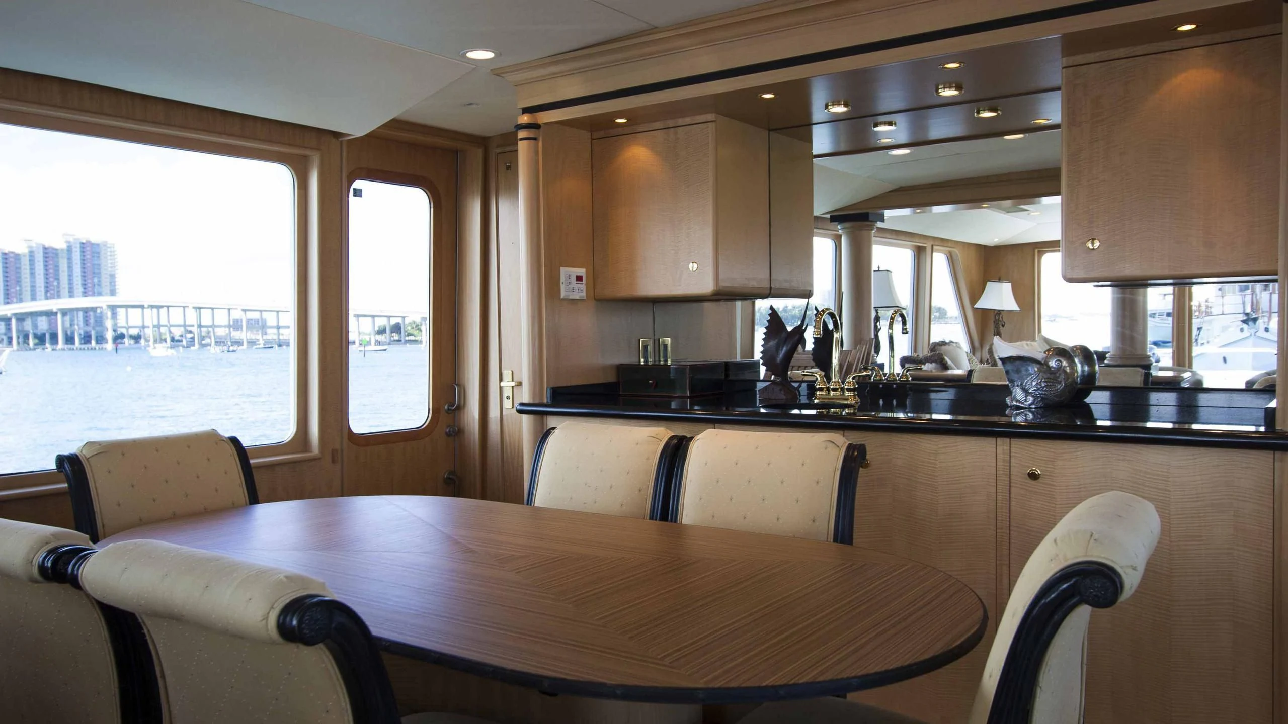 a kitchen with a table and chairs aboard MALDAU Yacht for Sale