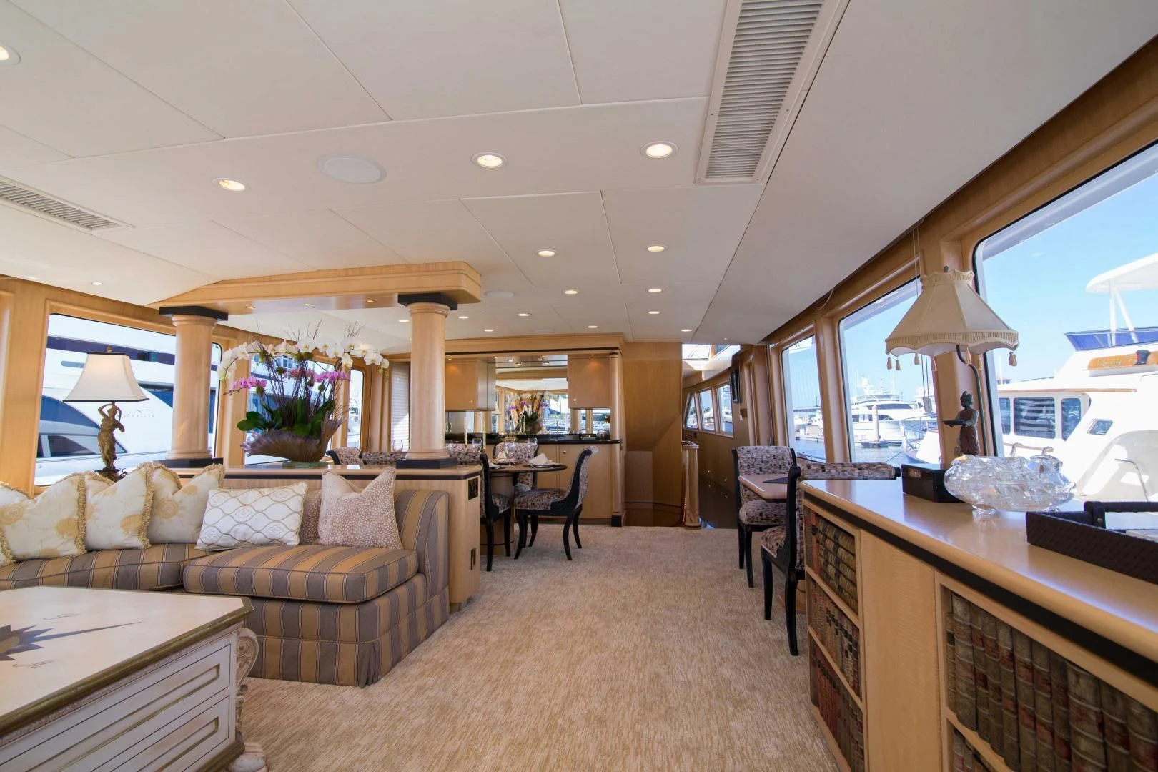 a living room with a couch and a table aboard MALDAU Yacht for Sale