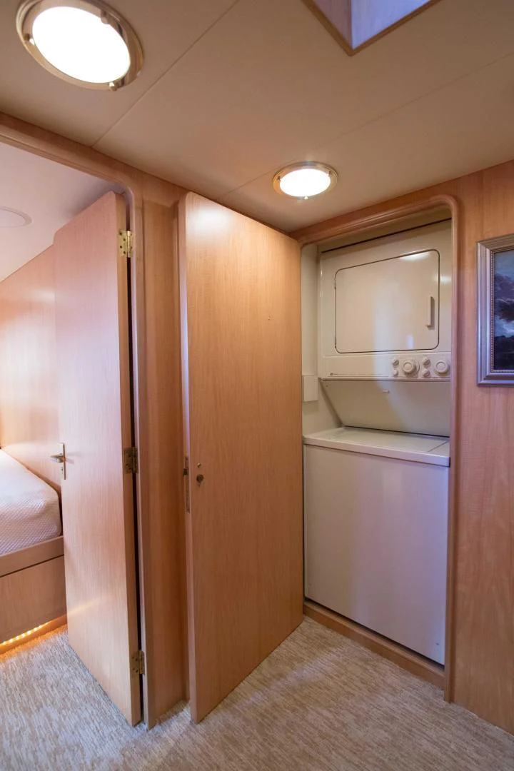 a bathroom with a wood door aboard MALDAU Yacht for Sale
