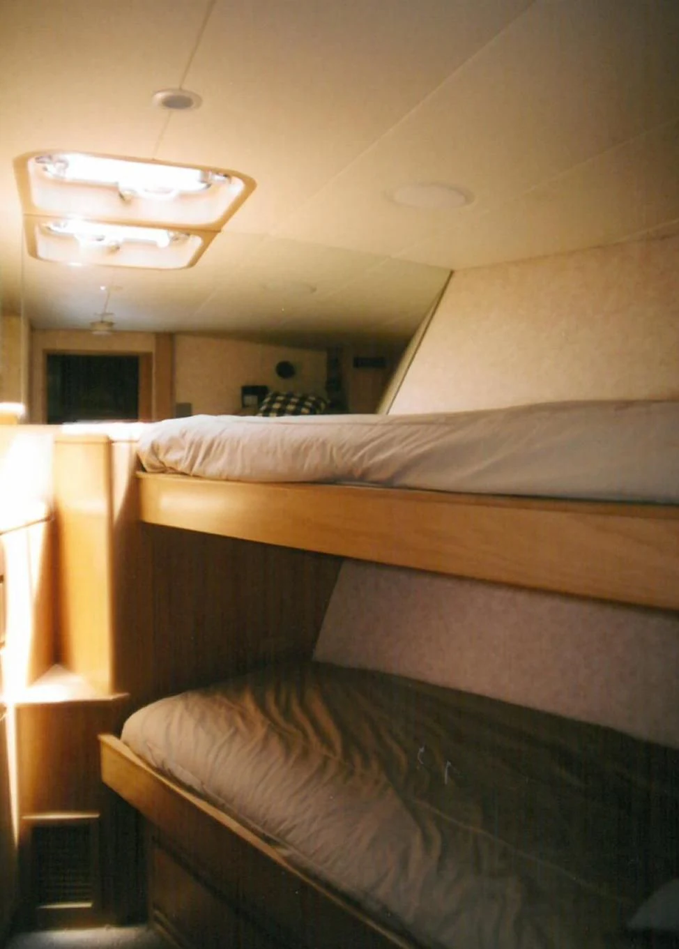 a room with a bed and a ceiling fan aboard MALDAU Yacht for Sale