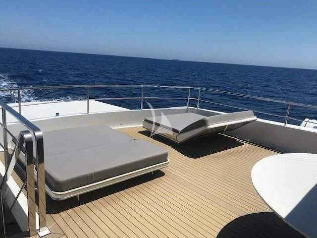 a bed on a deck overlooking the ocean aboard ENDEAVOUR 2 Yacht for Sale