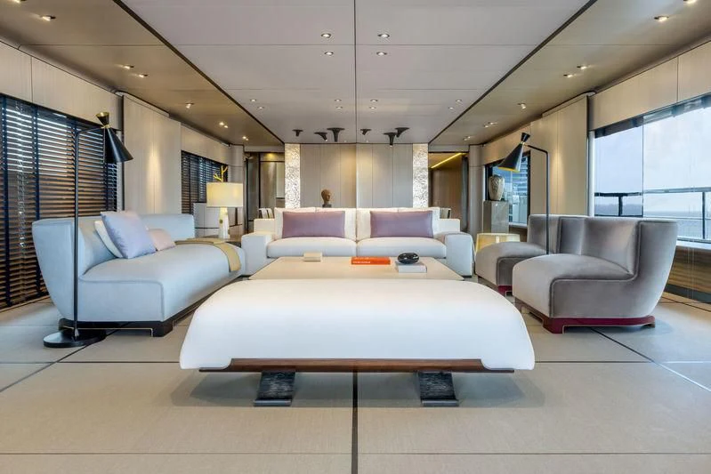 a large room with a bed and a couch aboard ENDEAVOUR 2 Yacht for Sale