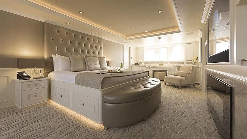 a large white bedroom with a large bed and a couch aboard ENDEAVOUR 2 Yacht for Sale