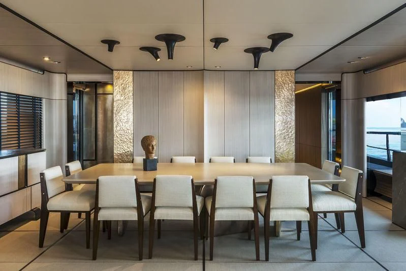a table with chairs around it aboard ENDEAVOUR 2 Yacht for Sale