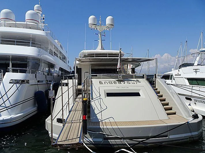 a boat docked next to a cruise ship aboard ENDEAVOUR 2 Yacht for Sale