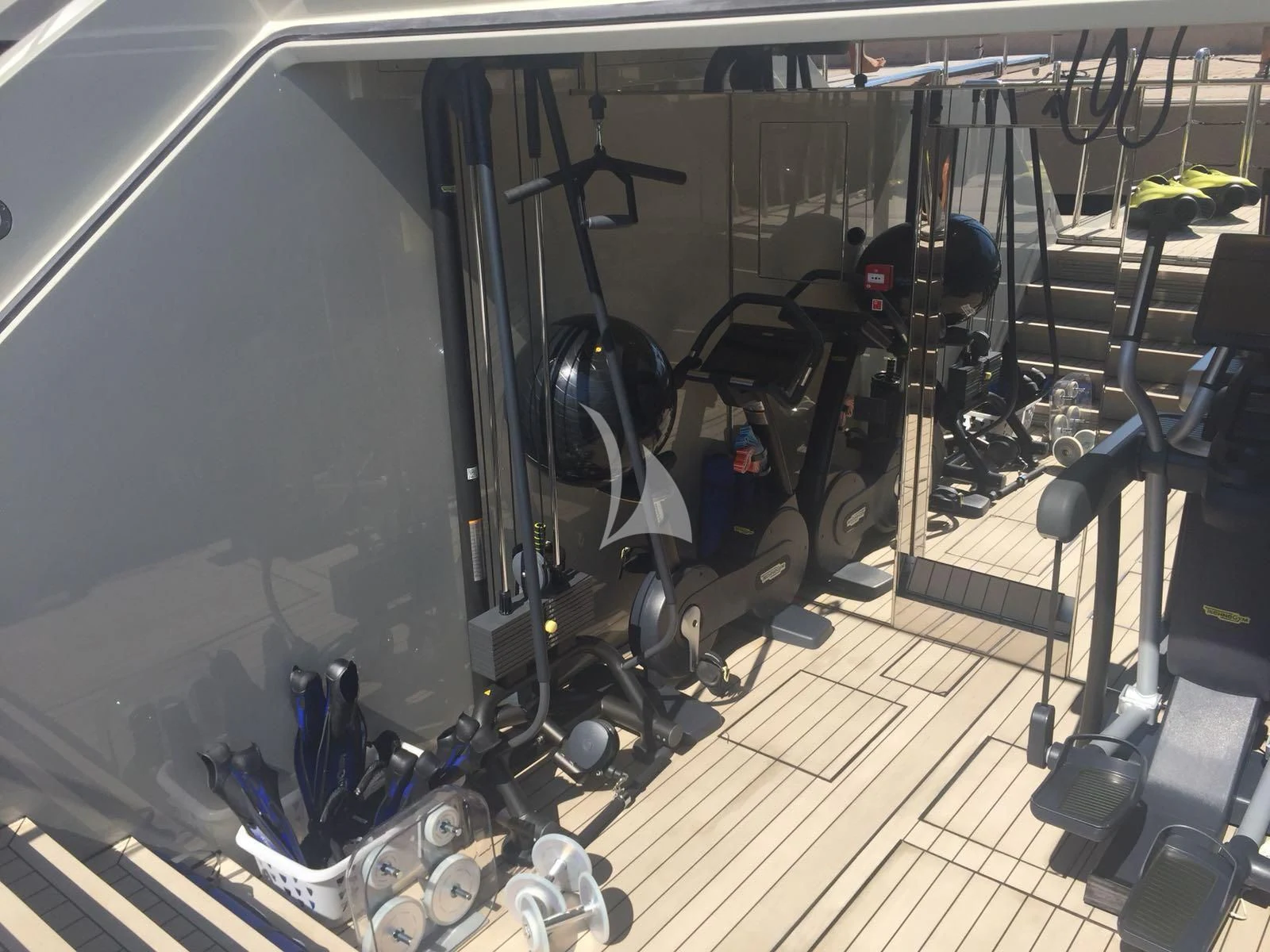 a large room with exercise equipment aboard ENDEAVOUR 2 Yacht for Sale